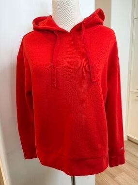 Alo red hooded sweatshirt with fun logo and open side slit